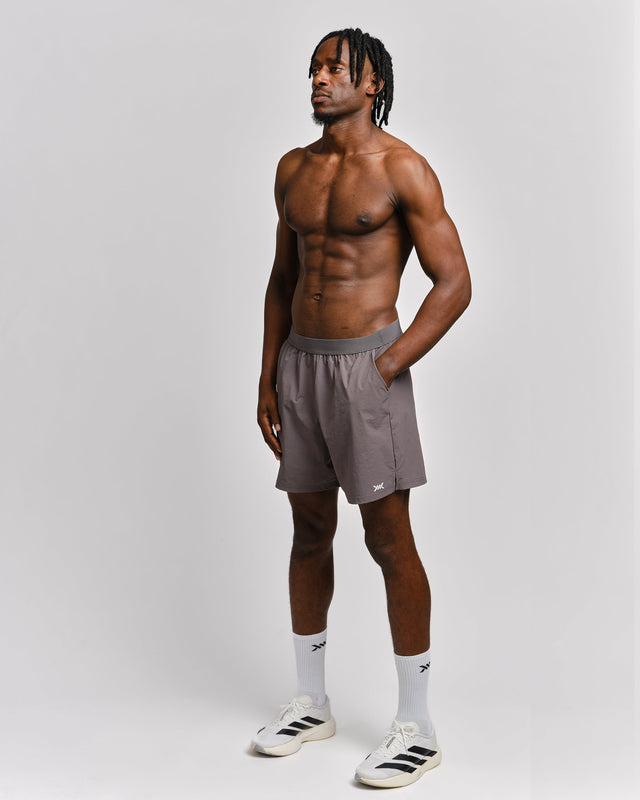 Pantalones de entrenamiento Caged Essential – Gris