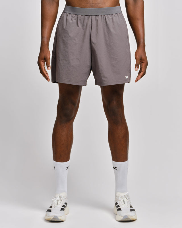 Pantalones de entrenamiento Caged Essential – Gris