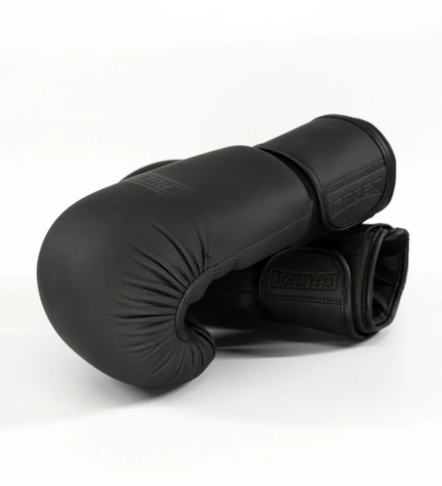 Bundel Guantoni da boxe + Paratibie Caged Shadow